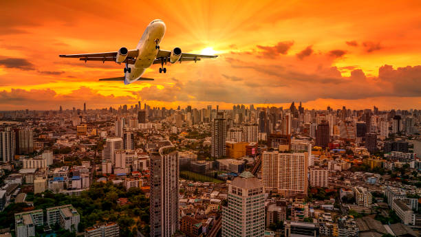 istock Airplane flying over cityscape 2 1053106814