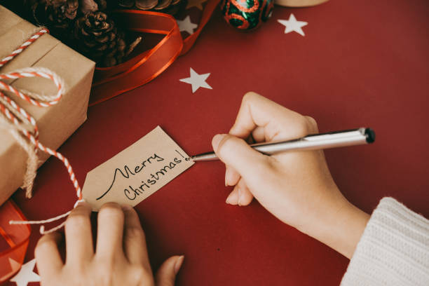 istock Writing Christmas wish on tag 1053106858