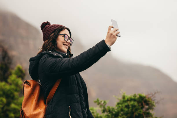 istock Traveler talking a selfie on hill top 1053109534