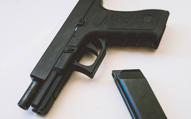 istock airsoft gun on a white background close-up. firearms practice concept 1053113902