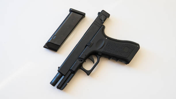 istock strikeball gun on the white backgroud. 1053113912