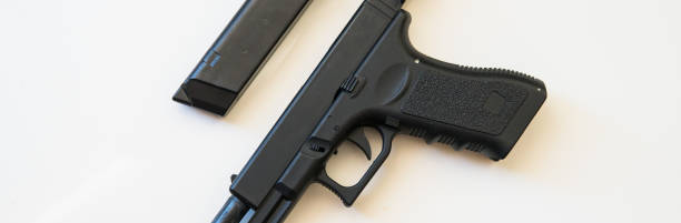 istock airsoft gun on a white background close-up. firearms practice concept 1053113914