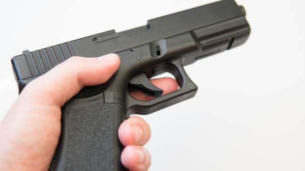 istock airsoft gun on a white background close-up. firearms practice concept 1053113940