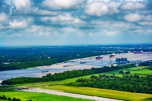 A line of cargo ships sailing on the Mississippi River near New Orleans shot from an altitude of about 600 feet during a helicopter photo flight.