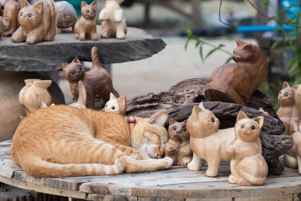 istock Cat sleeping among wood cat toys. 1053119290