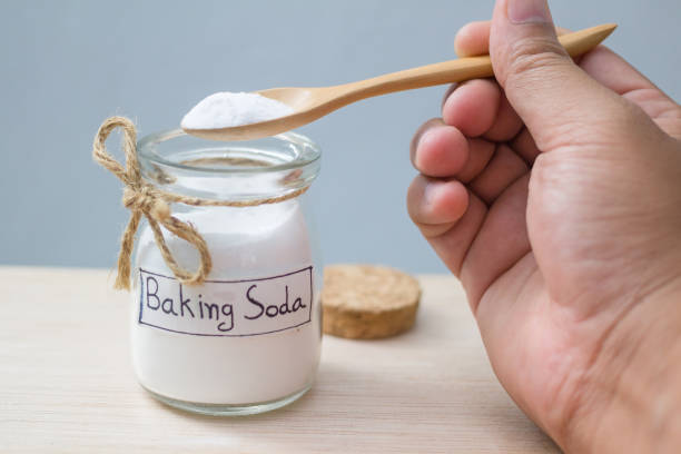istock baking soda on wooden table 1053122682