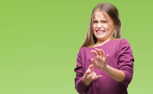 Young beautiful girl over isolated background disgusted expression, displeased and fearful doing disgust face because aversion reaction. With hands raised. Annoying concept. Young beautiful girl over isolated background disgusted expression, displeased and fearful doing disgust face because aversion reaction. With hands raised. Annoying concept. disgust stock pictures, royalty-free photos & images