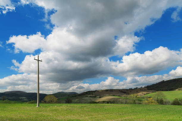 istock Natural landscape, green fields and blue sky with clouds 1053128960