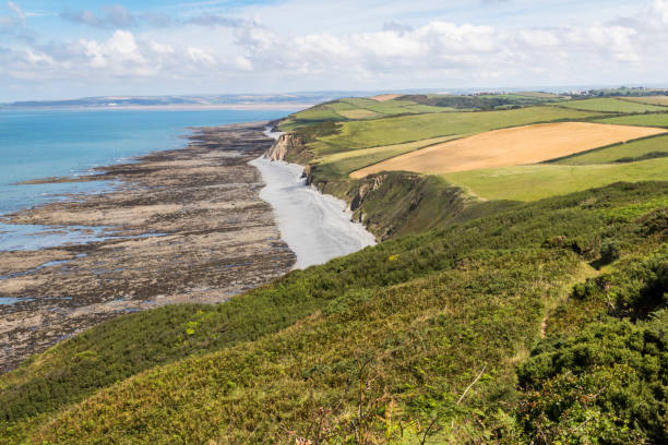 istock Greencliff; Low Tide View - Looking North Across the Pebble Beach and Fields Towards Bideford and Saunton: Greencliff, Near Bideford, Devon, UK. 1053129348