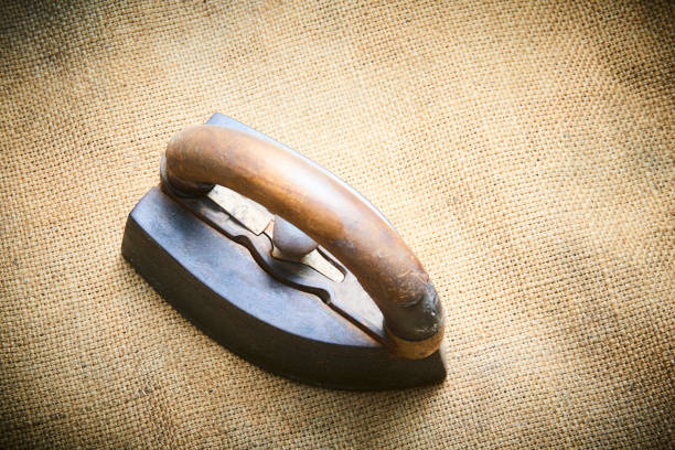 Close up of vintage old rusty iron on sack cloth. Selective focus