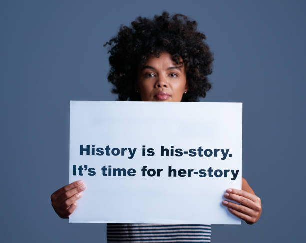 Her story is part of his-story too Studio shot of a young woman holding a sign saying “history is his-story. it’s time for her-story” me too social movement stock pictures, royalty-free photos & images