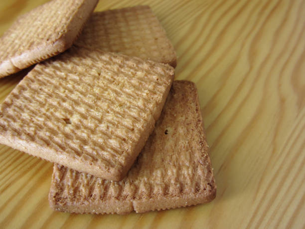 istock Close up of cookies on wooden table . Four biscuits for breakfast 1053136036