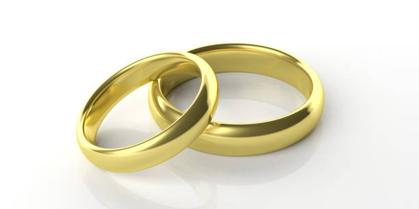 istock Two golden wedding rings isolated on white background, 3d illustration 1053136564