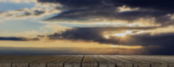 istock Wooden floor, cloudy sky at dawn background, banner, copy space. 3d illustration 1053136764