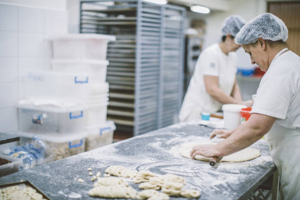 istock Women making pretzels 1053138200