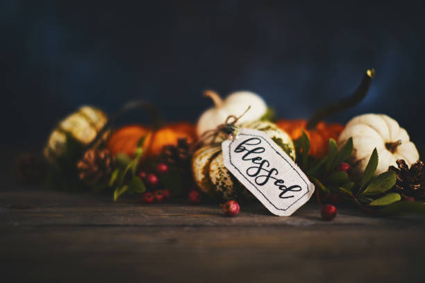 istock Fall pumpkin arrangement with holiday message reading Blessed 1053140414