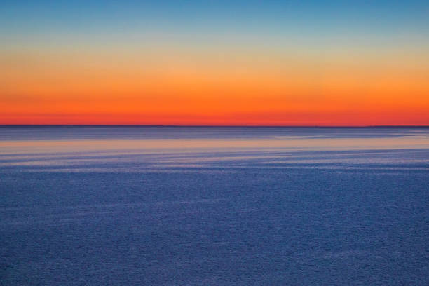 istock red sunset sky on the water surface of 1053143156