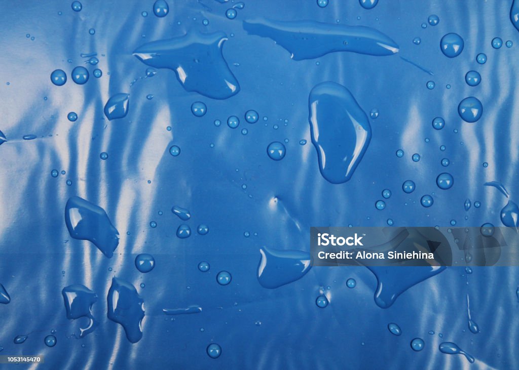 Blue texture of plastic (latex) with reflections and bubbles, similar to the sea texture. Background Abstract Stock Photo