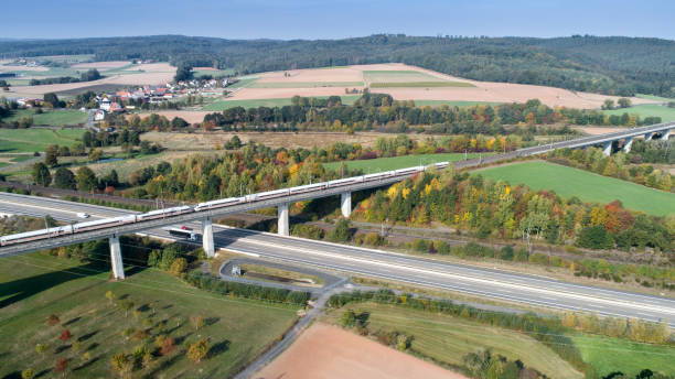 istock Highway and railroad track - aerial view 1053147910