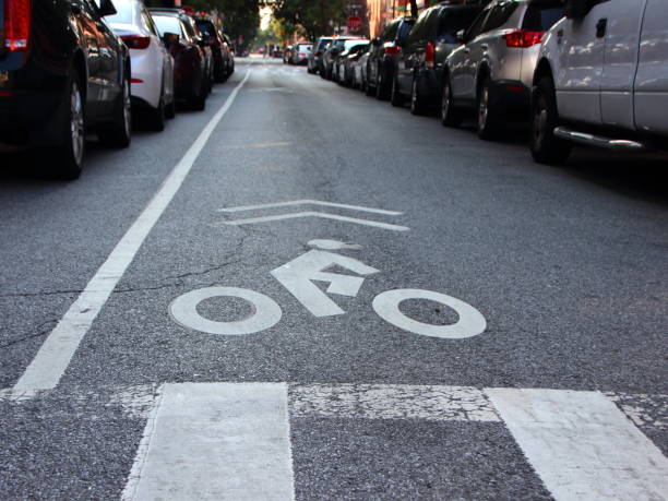 istock Single Unprotected Cyclist Lane on Urban Road 1053154390