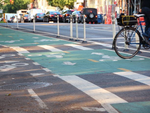 istock Biker Crossing Cycle Path in New York 1053154624