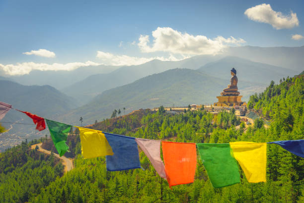 Bhutan Paro buddha landscape Paro Buddha with prayer flags in foreground and the valley in the background tibet culture stock pictures, royalty-free photos & images