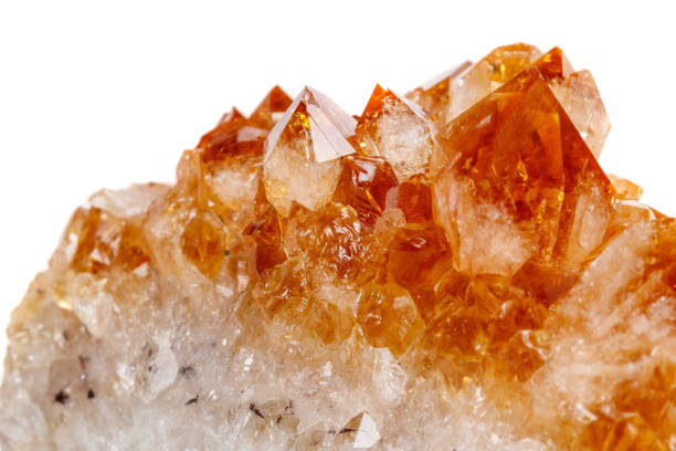 Macro mineral stone Citrine in rock in crystals on a white background close up