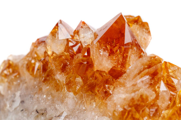 istock Macro mineral stone Citrine in rock in crystals on a white background 1053158362