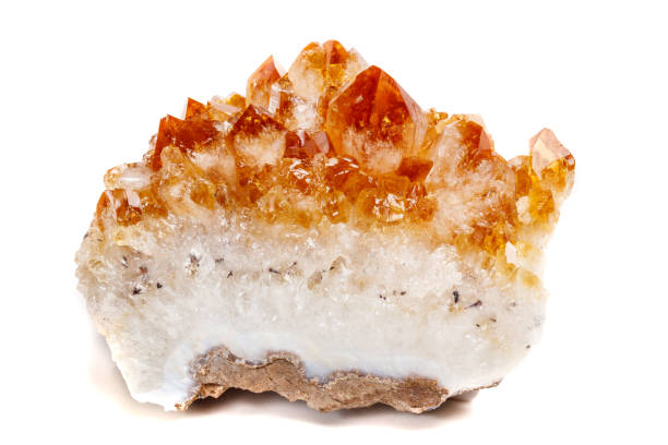 istock Macro mineral stone Citrine in rock in crystals on a white background 1053158542