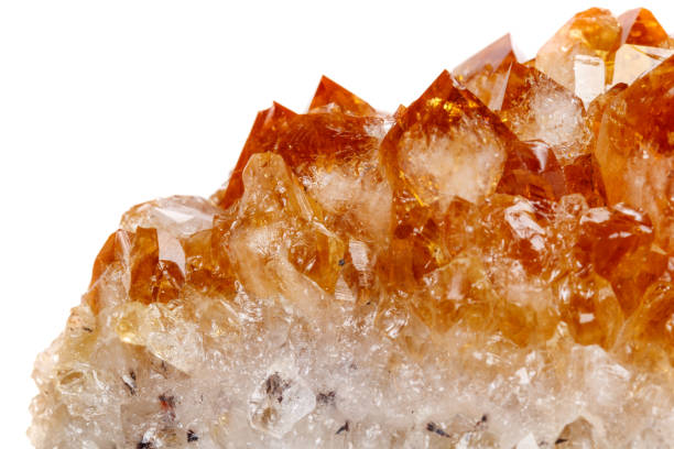 istock Macro mineral stone Citrine in rock in crystals on a white background 1053158596