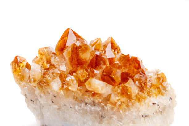 istock Macro mineral stone Citrine in rock in crystals on a white background 1053158842