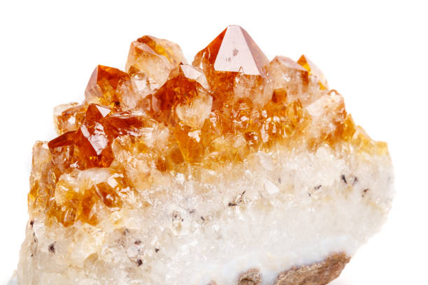 istock Macro mineral stone Citrine in rock in crystals on a white background 1053160970