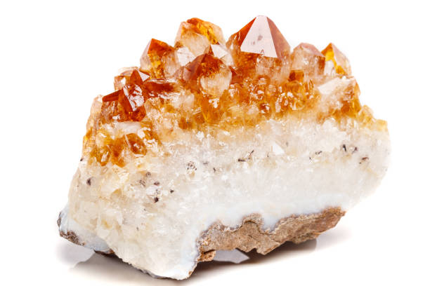 istock Macro mineral stone Citrine in rock in crystals on a white background 1053161010