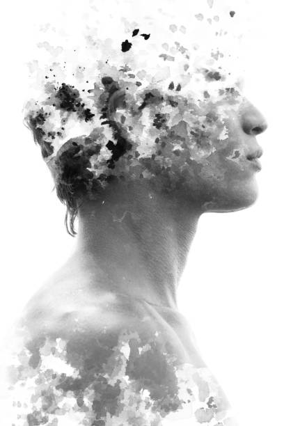 Paintography. Double exposure of an attractive model combined with hand drawn ink paintings with depth and texture, black and white stock photo