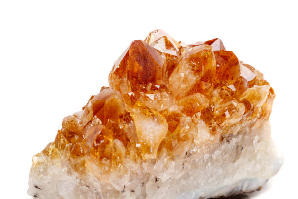 istock Macro mineral stone Citrine in rock in crystals on a white background 1053161130