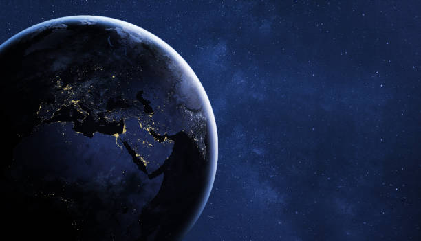 istock planet Earth by night in starry sky, view from space 1053161900