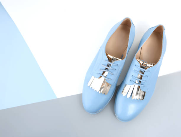 istock Blue leather lady flat  shoes with lace top view empty background. 1053171074