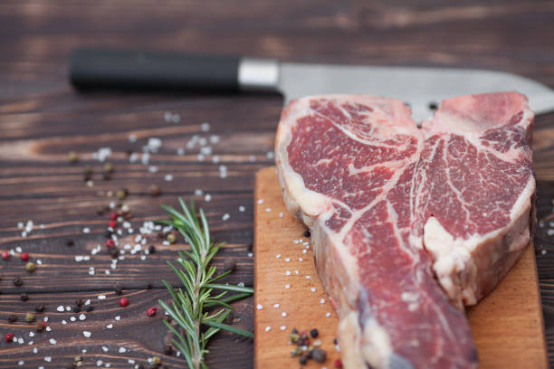 istock fresh raw meat on old wooden table 1053173438