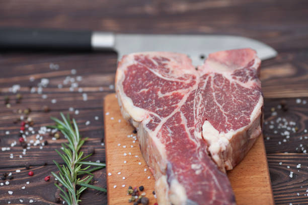 istock fresh raw meat on old wooden table 1053173476