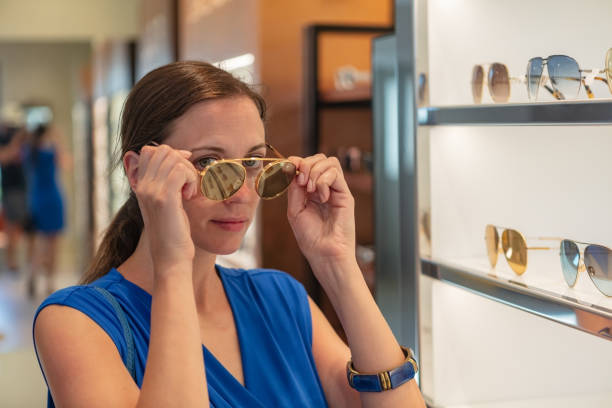 istock Woman choosing sunglasses 1053173636