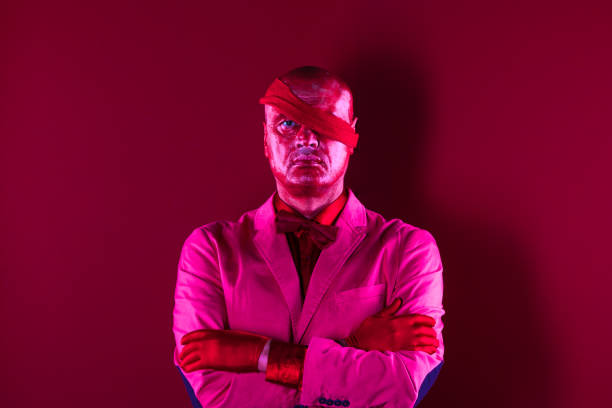 istock one-eyed man with a bandage on his head 1053180300