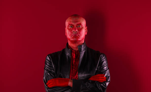 istock biker portrait on red background 1053182228