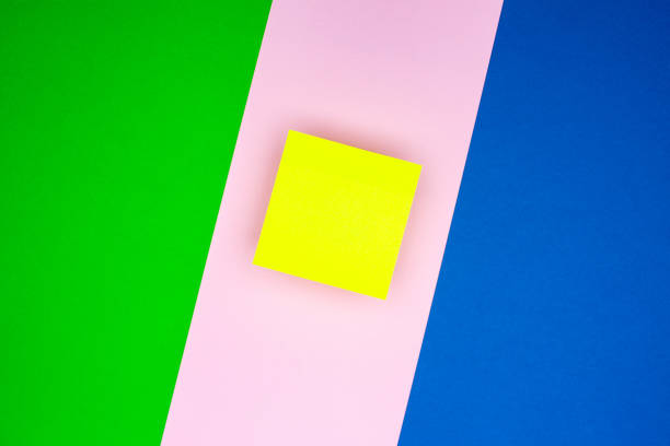 abstract texture of colored paper with a yellow sticker in the air in the center - 7651 imagens e fotografias de stock