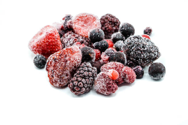 istock Various frozen wild berries isolated on white background 1053193356