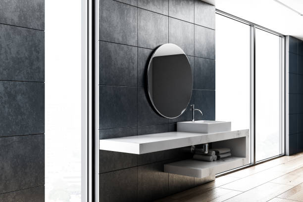 istock White bathroom sink in concrete room side view 1053198140