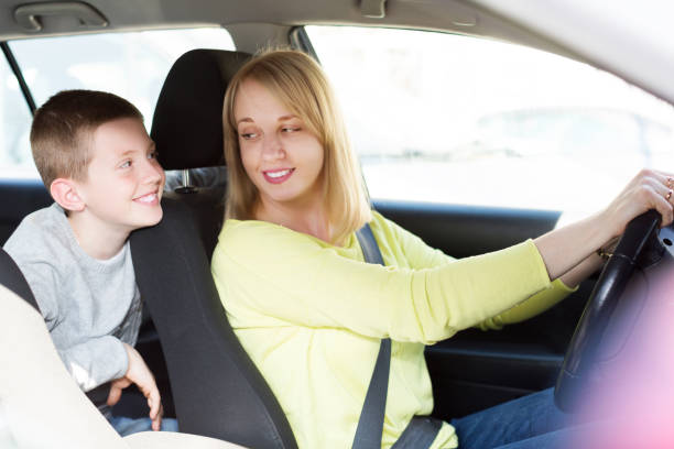 istock Woman and boy using car during sightseeing tour 1053198904