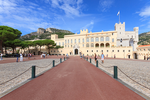 Principality of Monaco - September 02, 2018: Panoramic view of the Prince's Palace of Monaco, the official residence of the Sovereign Prince of Monaco, tourists in the frontal square.