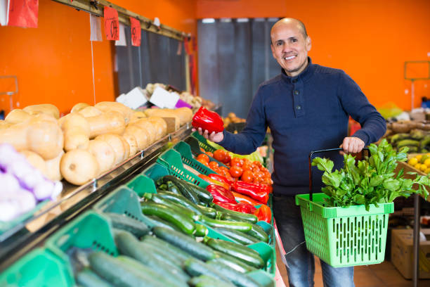 istock Customer buying vegetables at market 1053203110