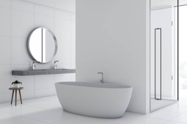 istock White bathroom inteiror, tub and shower 1053204204