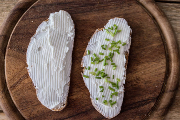 istock Snack food - rye bread slices with cheese spread 1053205298